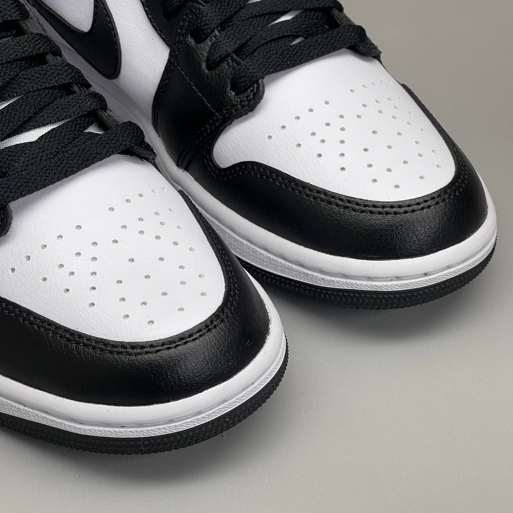 Nike Air Jordan 1 Mid Panda shoes for women, size 6, black and white sneakers with iconic design and branding.