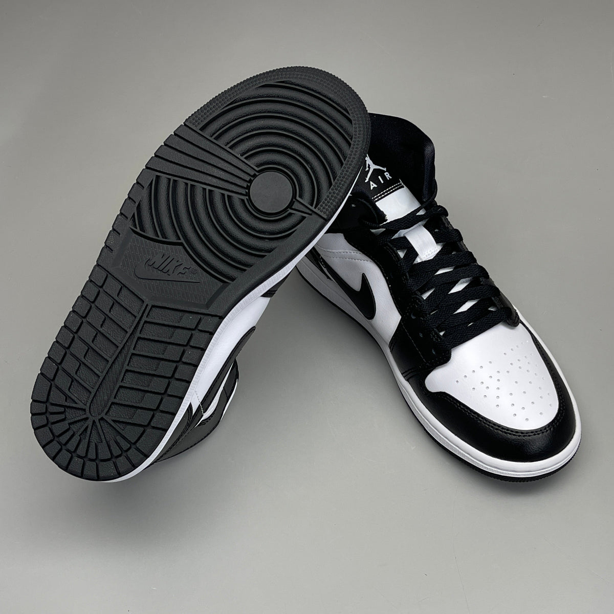 Nike Air Jordan 1 Mid Panda women's sneakers in black and white, size 6, featuring distinctive panda color blocking.