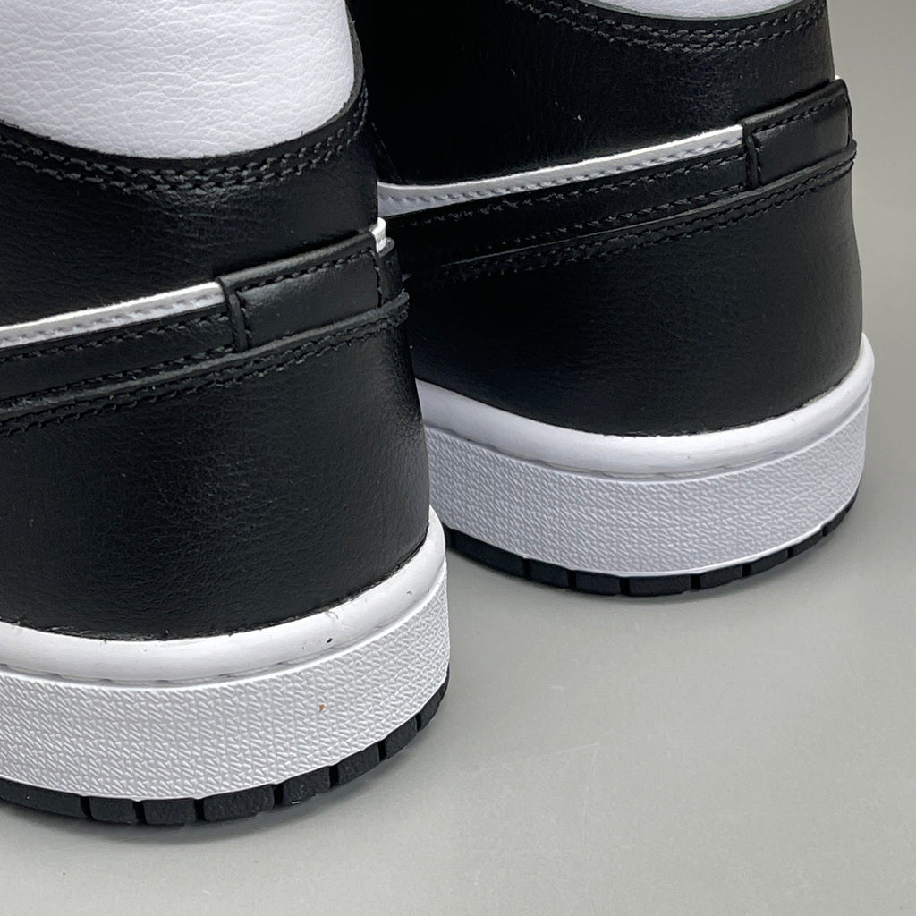 Nike Air Jordan 1 Mid Panda shoes for women, size 6, black and white colorway, featuring a classic sneaker design.
