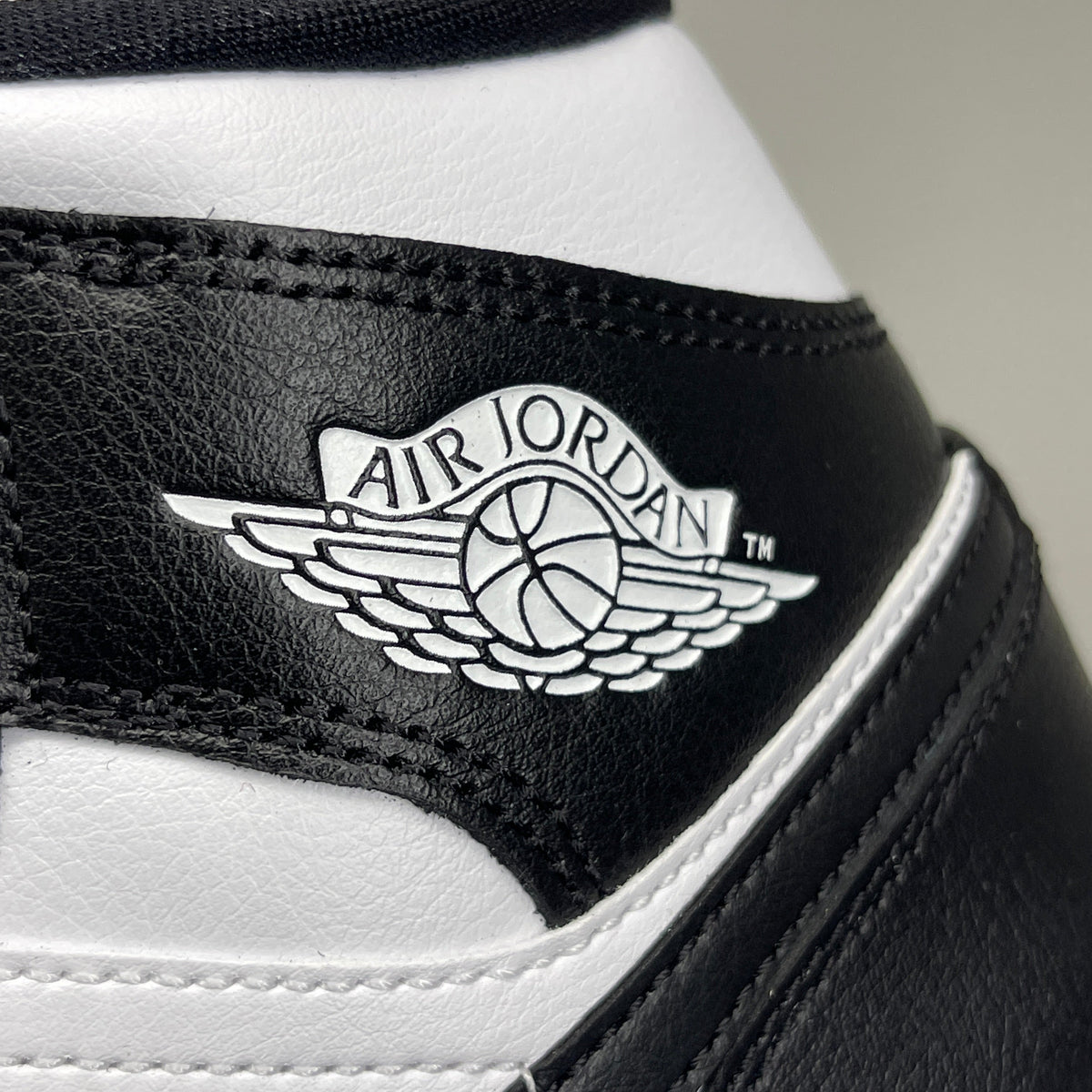 Nike Air Jordan 1 Mid Panda women's shoe in black and white, size 6, featuring a stylish high-top design and iconic branding.