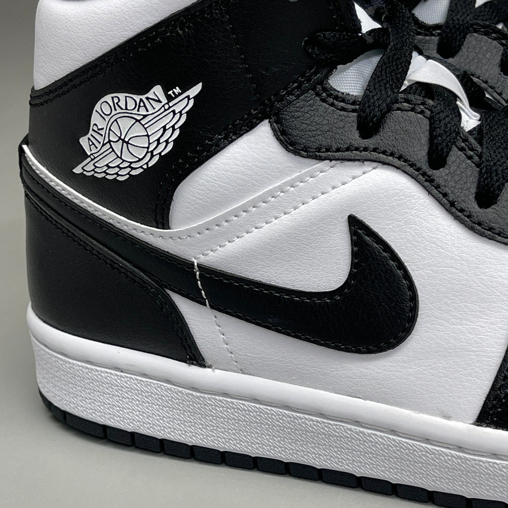 Women's Nike Air Jordan 1 Mid Panda sneakers in black and white, size 6, with classic color blocking and stylish design.