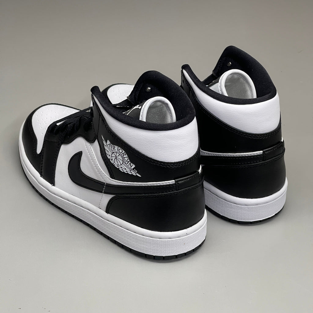 Nike Air Jordan 1 Mid Panda women's sneaker in black and white, featuring a classic design and high-top silhouette.