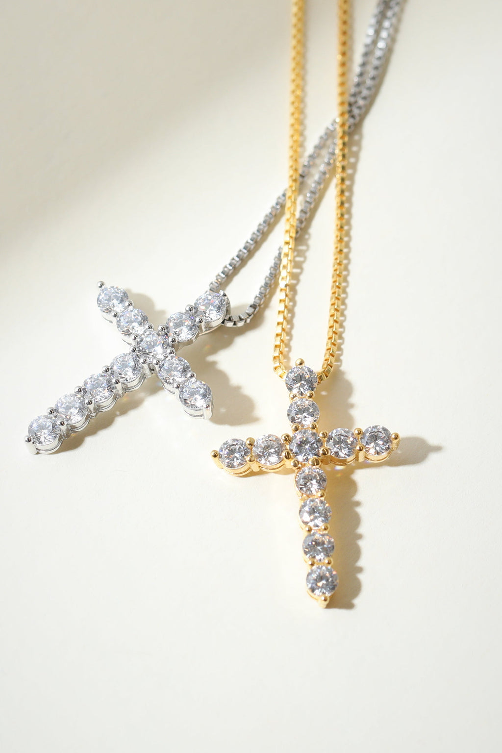 Silver Bella Pavé Cross Pendant with sparkling gemstones, religious jewelry from The M Jewelers, displayed on a white background.