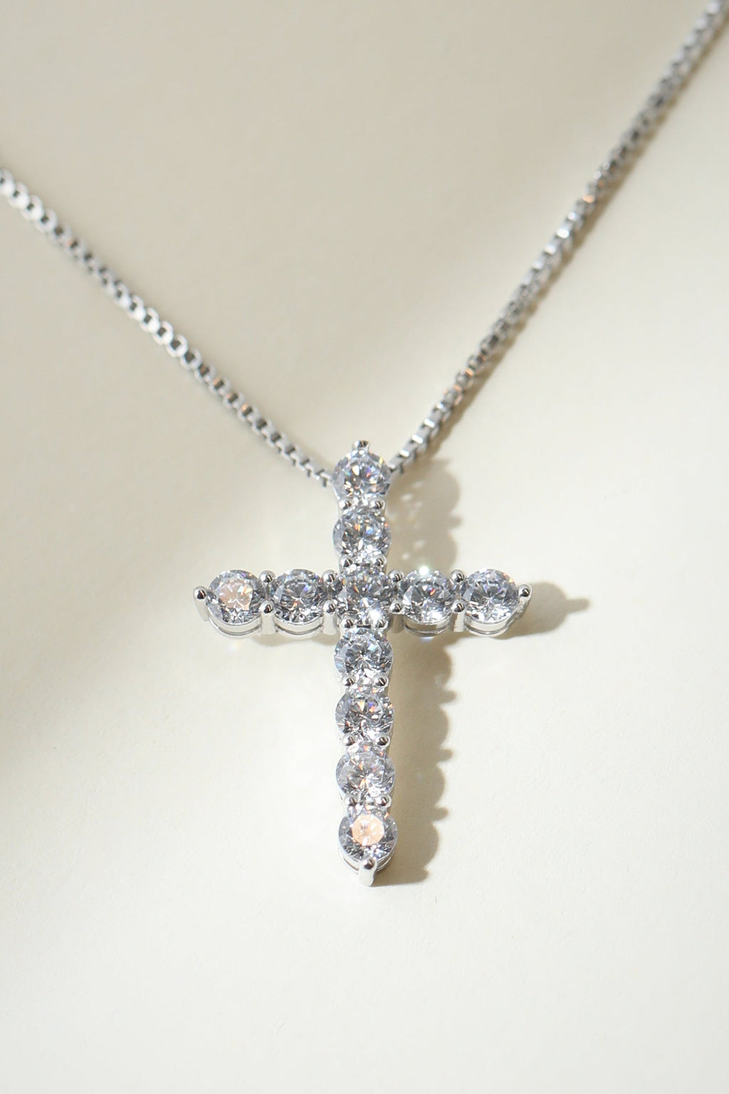 Silver Bella Pavé Cross Pendant with sparkling stones, featuring a religious design and intricate craftsmanship from The M Jewelers.