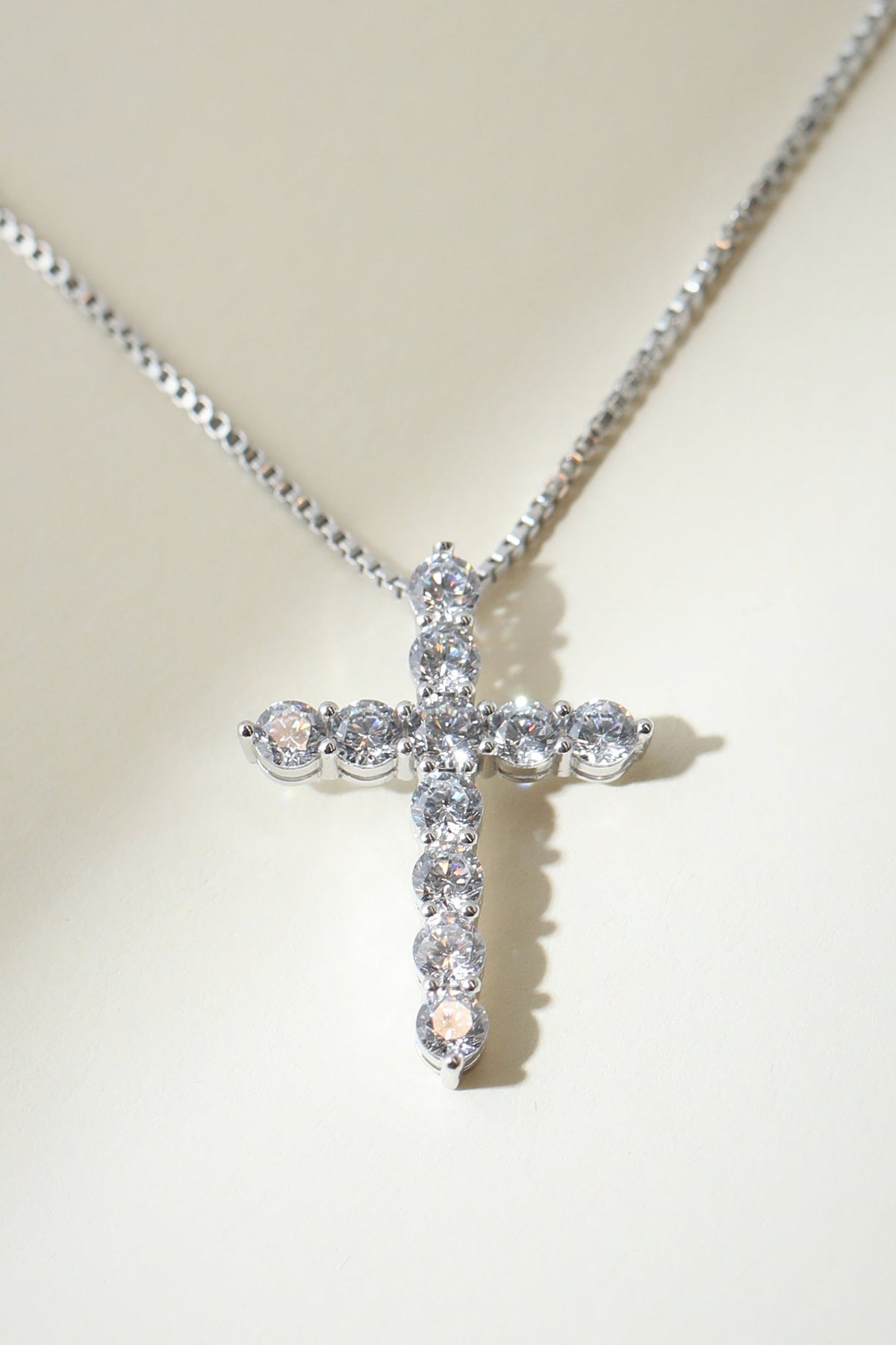 Silver Bella Pavé Cross Pendant with sparkling stones, featuring a religious design and intricate craftsmanship from The M Jewelers.