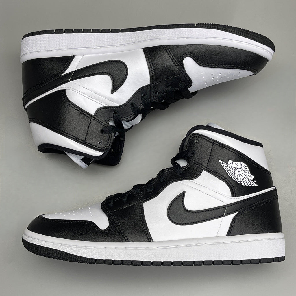 Women's Nike Air Jordan 1 Mid Panda sneakers in black and white, size 6, featuring a classic design and iconic style.
