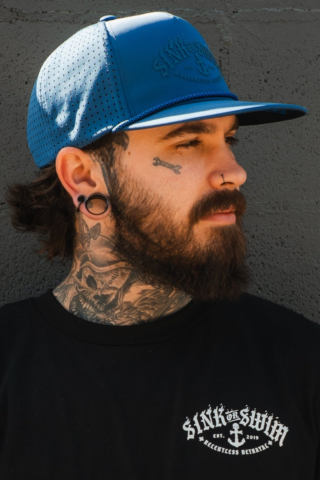 Dark Waters SOS Mute PVC snapback hat by Relentless Betrayal with adjustable strap and embroidered logo on the front.
