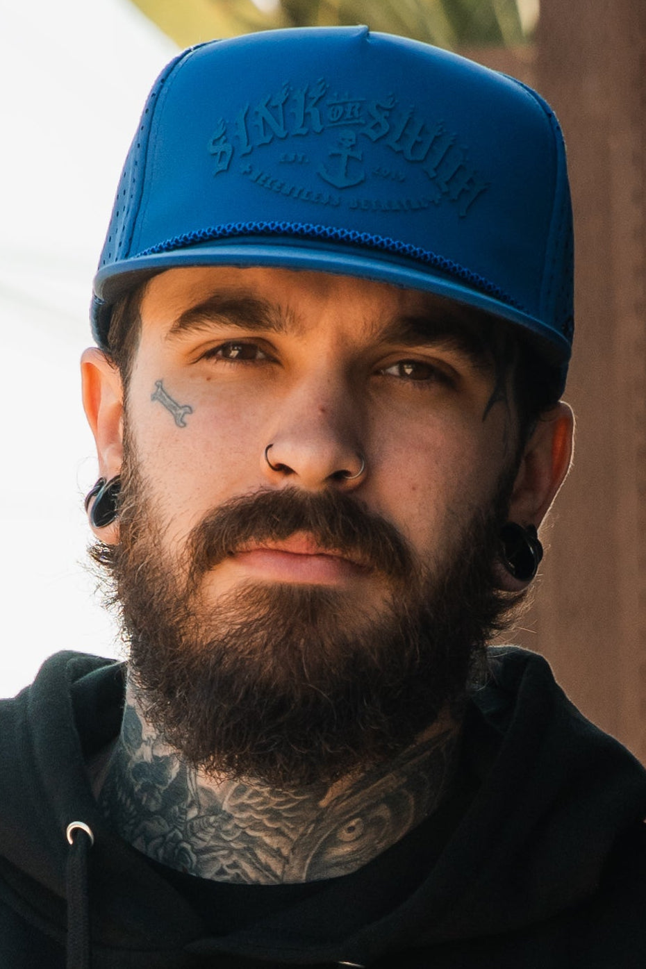 Dark Waters SOS Mute PVC snapback hat by Relentless Betrayal, showcasing the black hat with a flat brim and embroidered logo design.