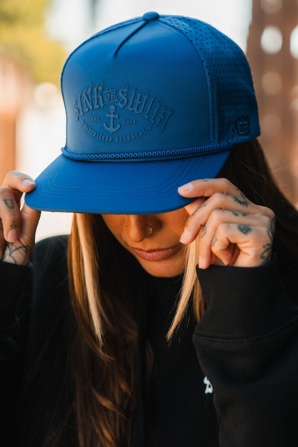 Dark Waters SOS Mute PVC snapback hat by Relentless Betrayal featuring a black and dark design with a flat brim and adjustable snapback closure.
