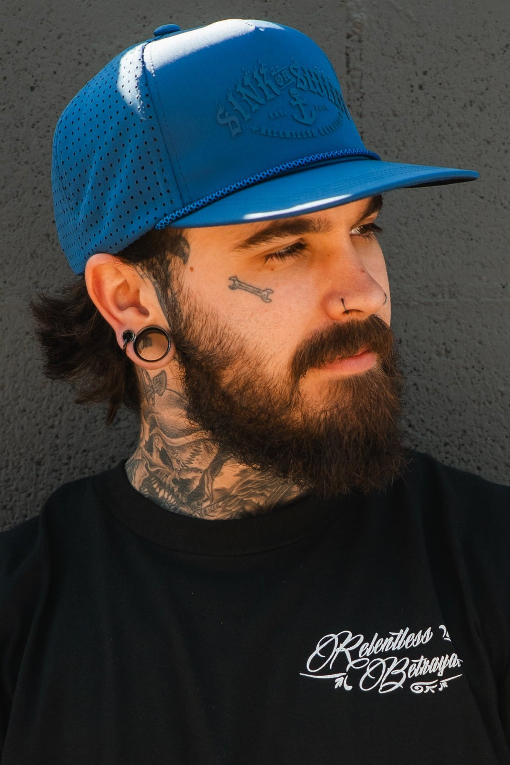Relentless Betrayal Dark Waters SOS Mute PVC snapback hat with flat brim and adjustable strap, featuring dark water-themed design.