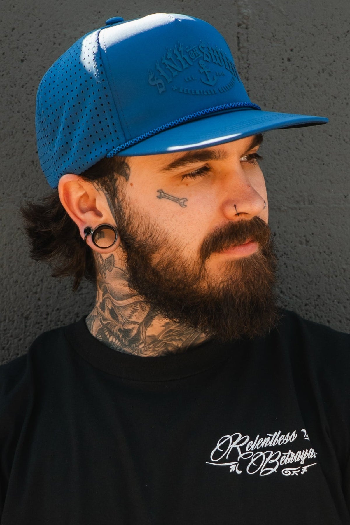 Relentless Betrayal Dark Waters SOS Mute PVC snapback hat with flat brim and adjustable strap, featuring dark water-themed design.