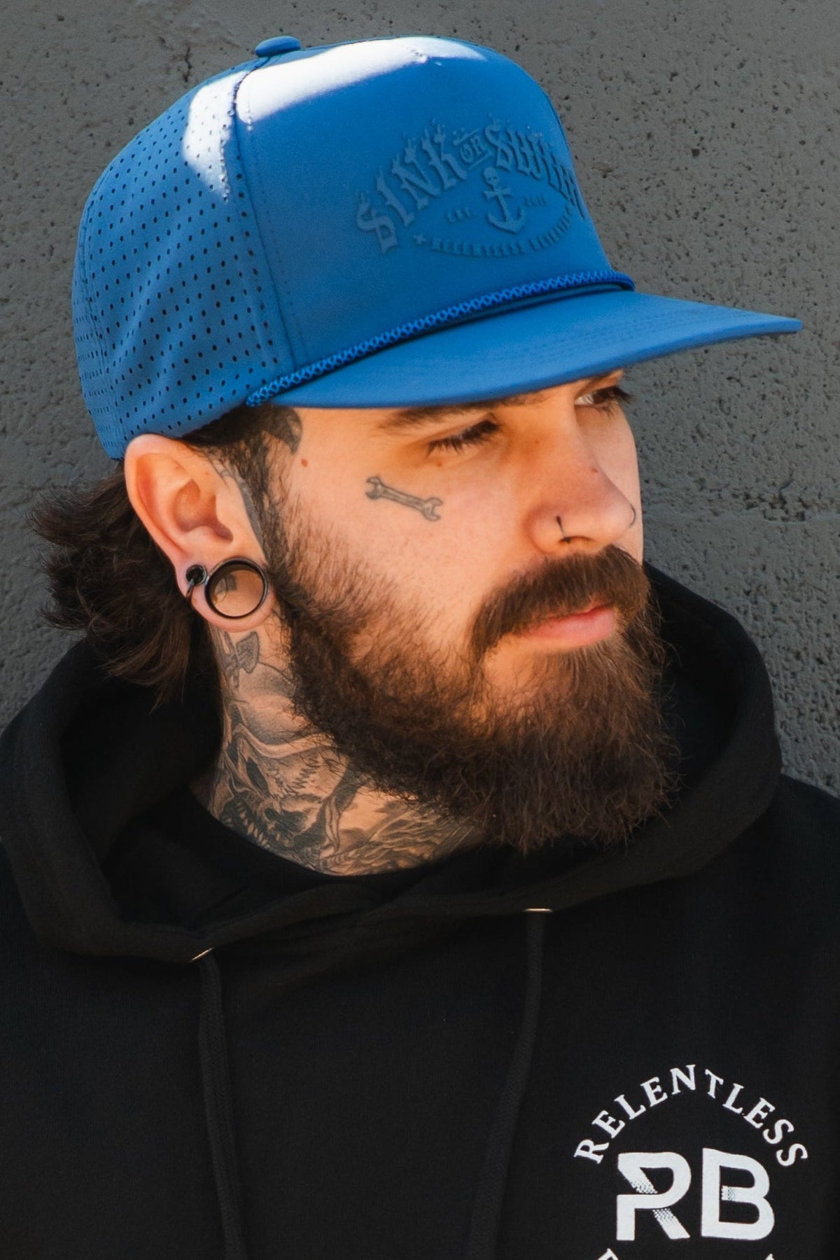 Relentless Betrayal Dark Waters SOS Mute PVC snapback hat with flat brim and adjustable strap, featuring a dark water-themed design.