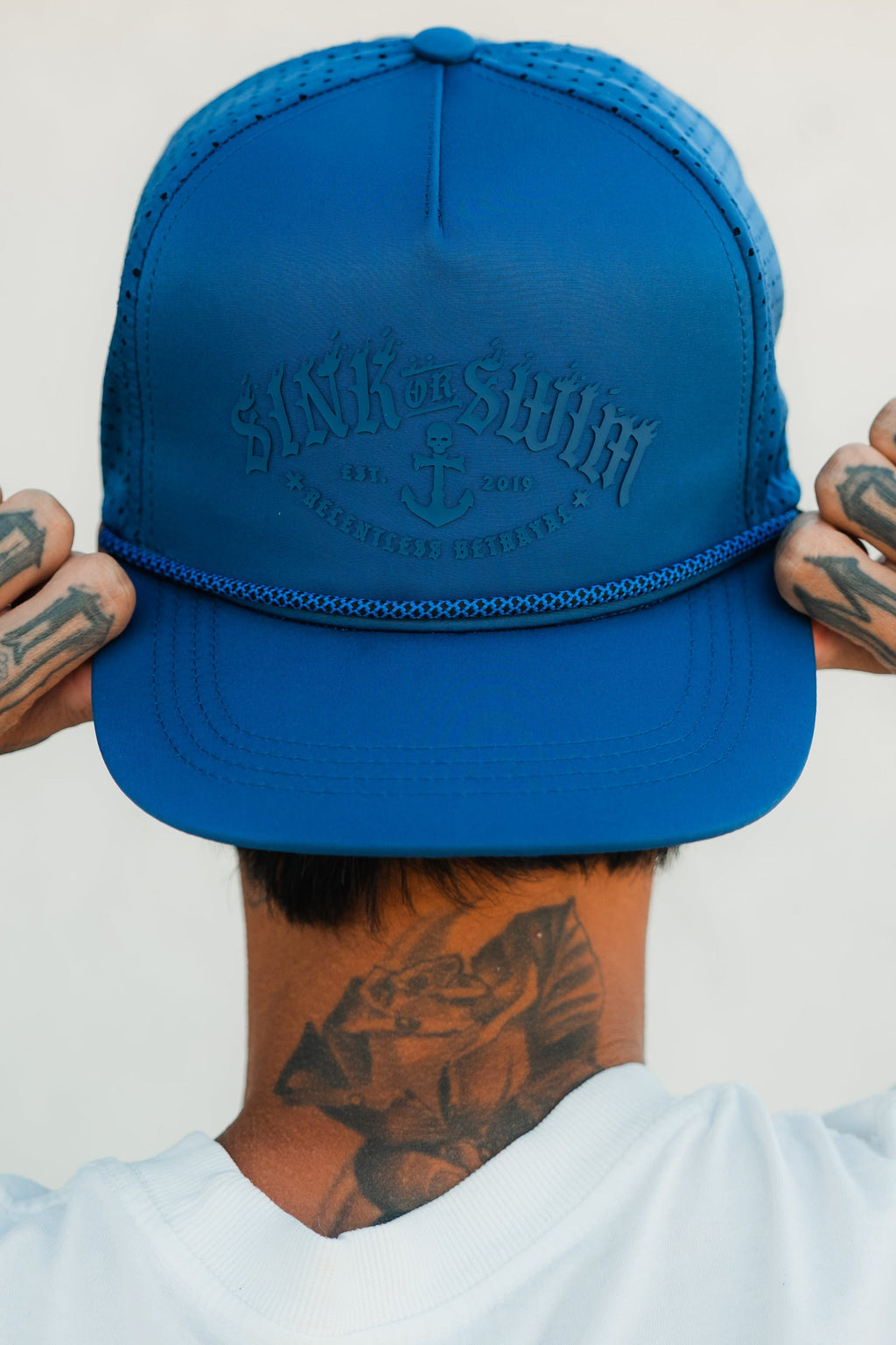 Relentless Betrayal Dark Waters SOS Mute PVC snapback hat with flat brim and embroidered logo, black design on front.