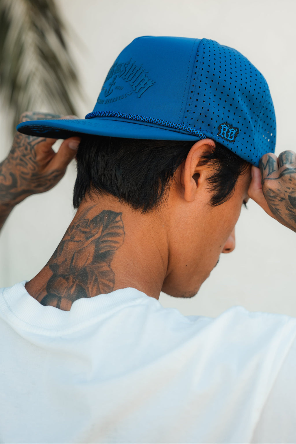 Relentless Betrayal Dark Waters SOS Mute PVC snapback hat with black and dark blue design, front logo, and flat brim.