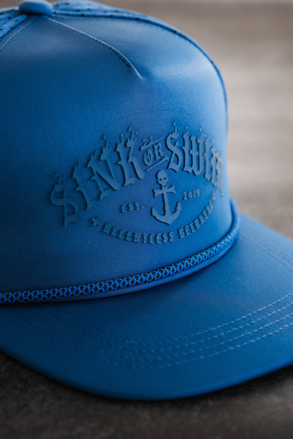 Relentless Betrayal Dark Waters SOS Mute PVC snapback hat with logo embroidery and flat brim, front view.
