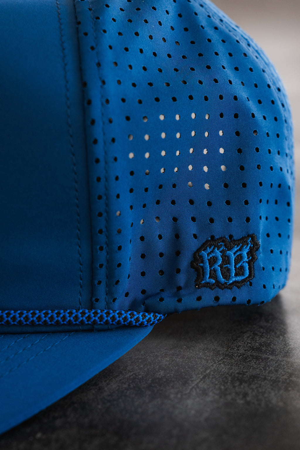Relentless Betrayal Dark Waters SOS Mute PVC snapback hat with black and dark blue design, flat brim and adjustable strap.