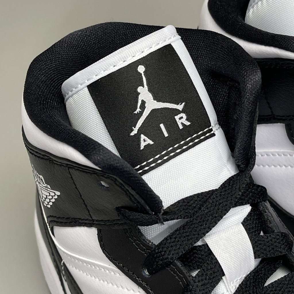 Nike Air Jordan 1 Mid Panda shoes for women, size 6, black and white colorway, featuring iconic sneaker design.