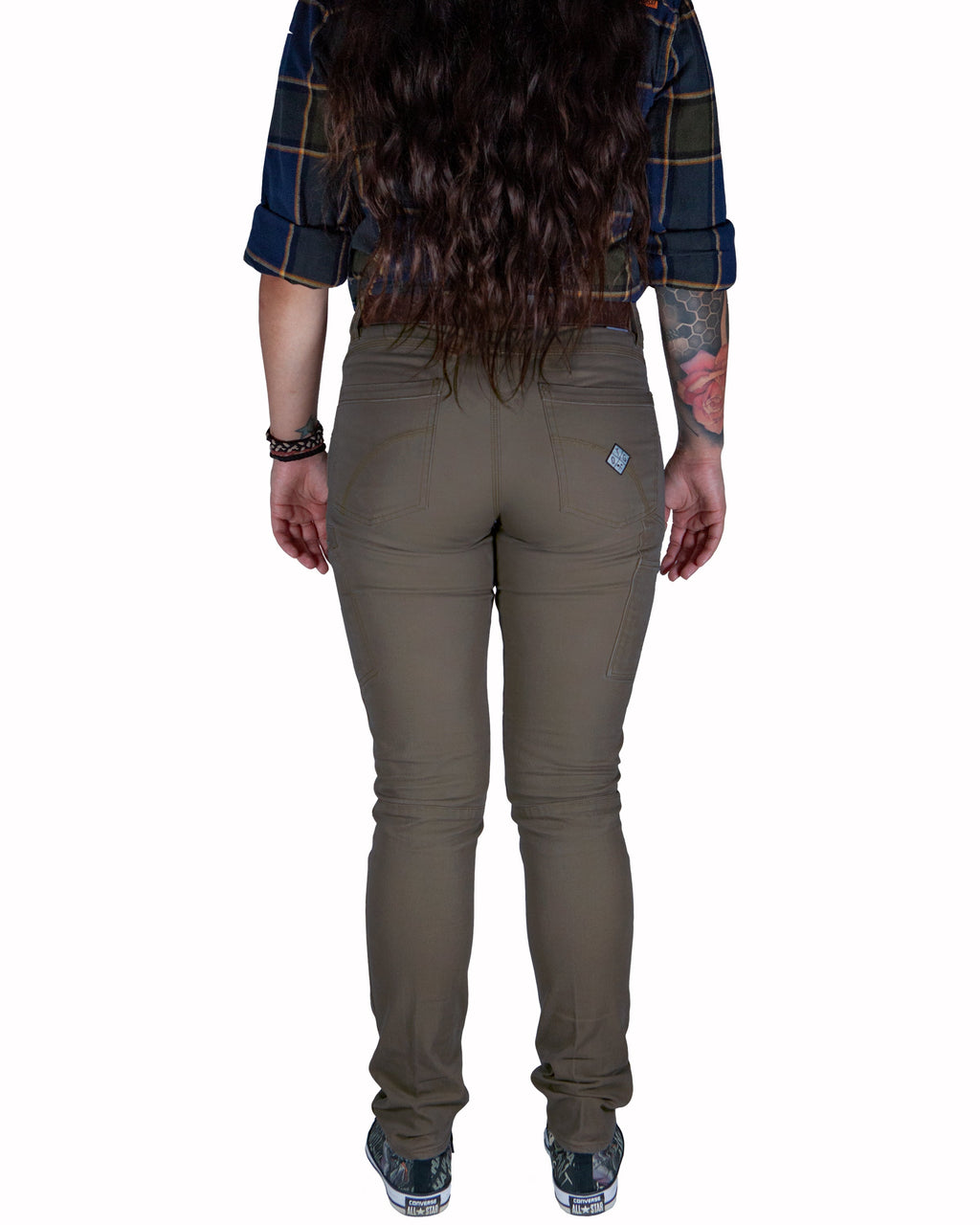 Kestral Women's Deadwood Pants by Off The Grid Surplus, featuring durable fabric and a relaxed fit, displayed on a hanger.