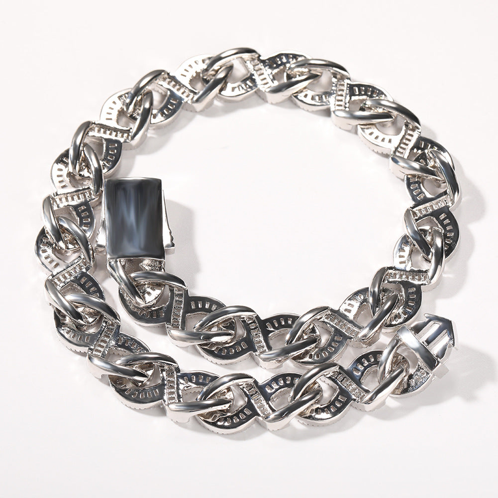 15mm diamond-cut geometric infinity Cuban chain from nowadaysfashion, showing the shiny, interconnected links in a close-up view.