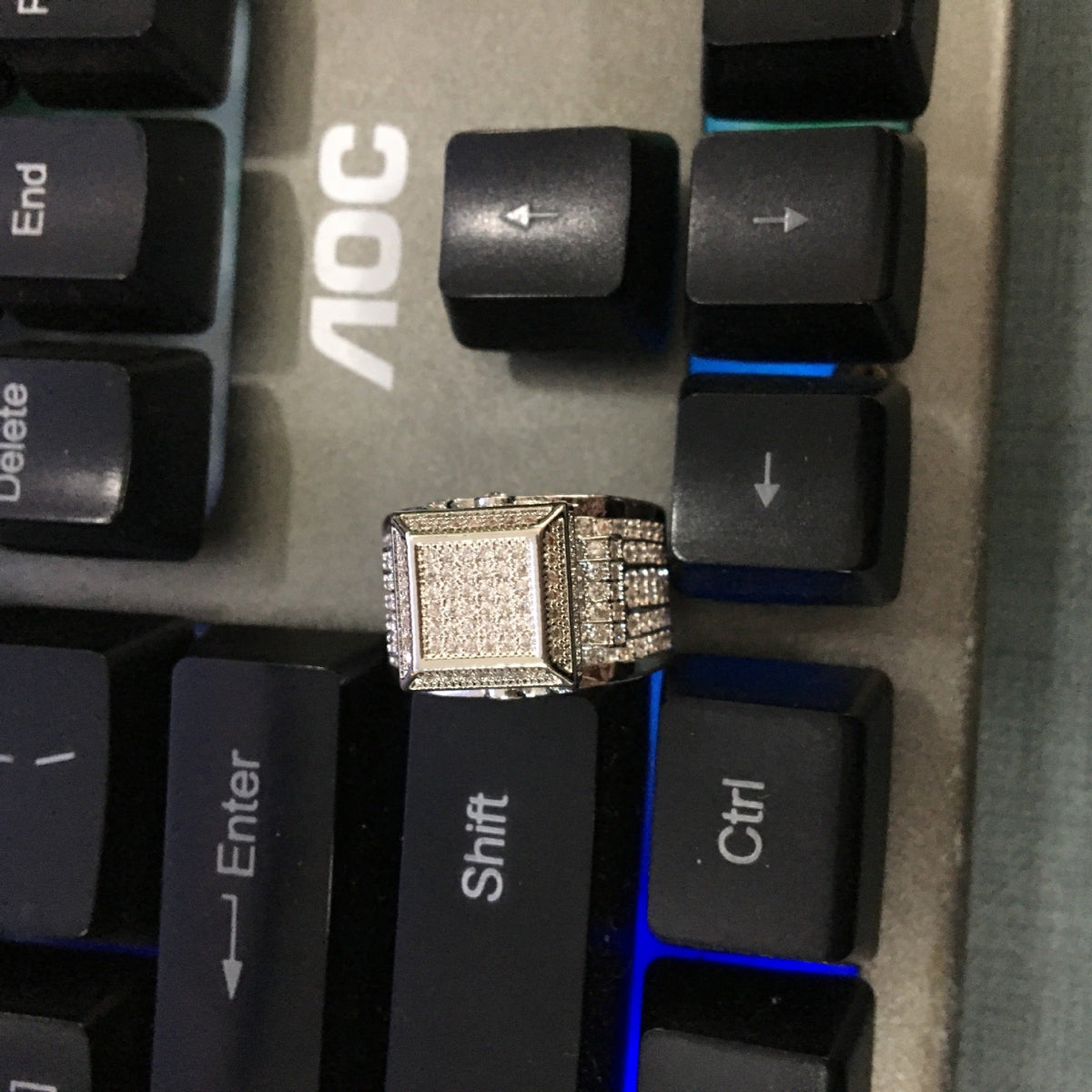 Square diamond-encrusted couple ring by NowadaysFashion featuring hip-hop style, with sparkling diamonds and bold design.