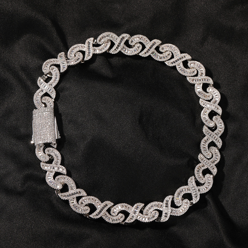 15mm diamond geometric infinity Cuban chain from NowadaysFashion, close-up of shiny gold chain with intricate geometric links.