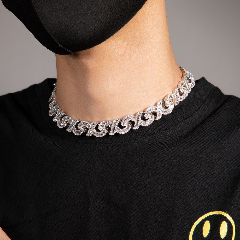 15mm diamond-cut geometric infinity Cuban chain by nowadaysfashion, showcasing a shiny, bold silver jewelry piece.