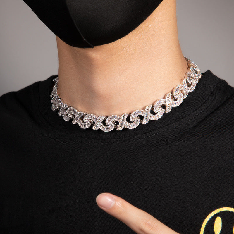 15mm diamond-cut geometric infinity Cuban chain by NowadaysFashion showcasing a bold, shiny gold jewelry piece.