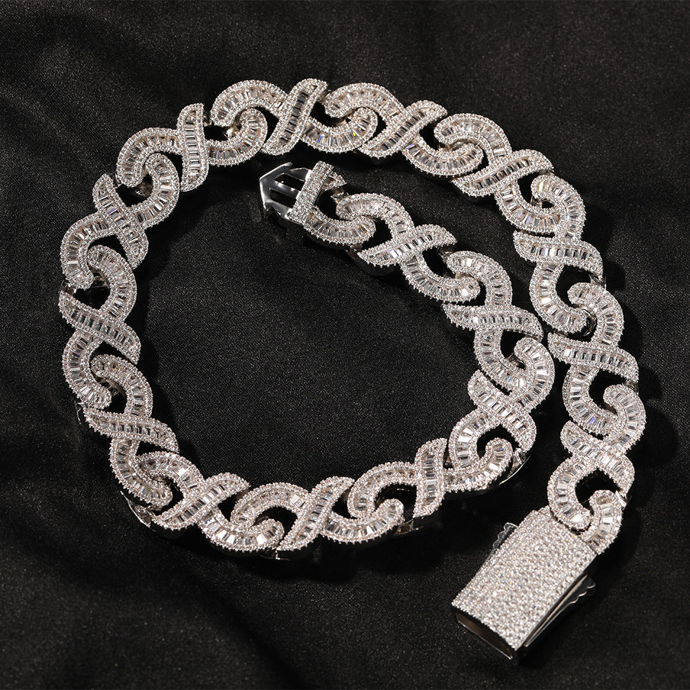 Close-up of 15mm diamond-cut geometric infinity Cuban chain by nowadaysfashion, showcasing its shiny, intricate links.