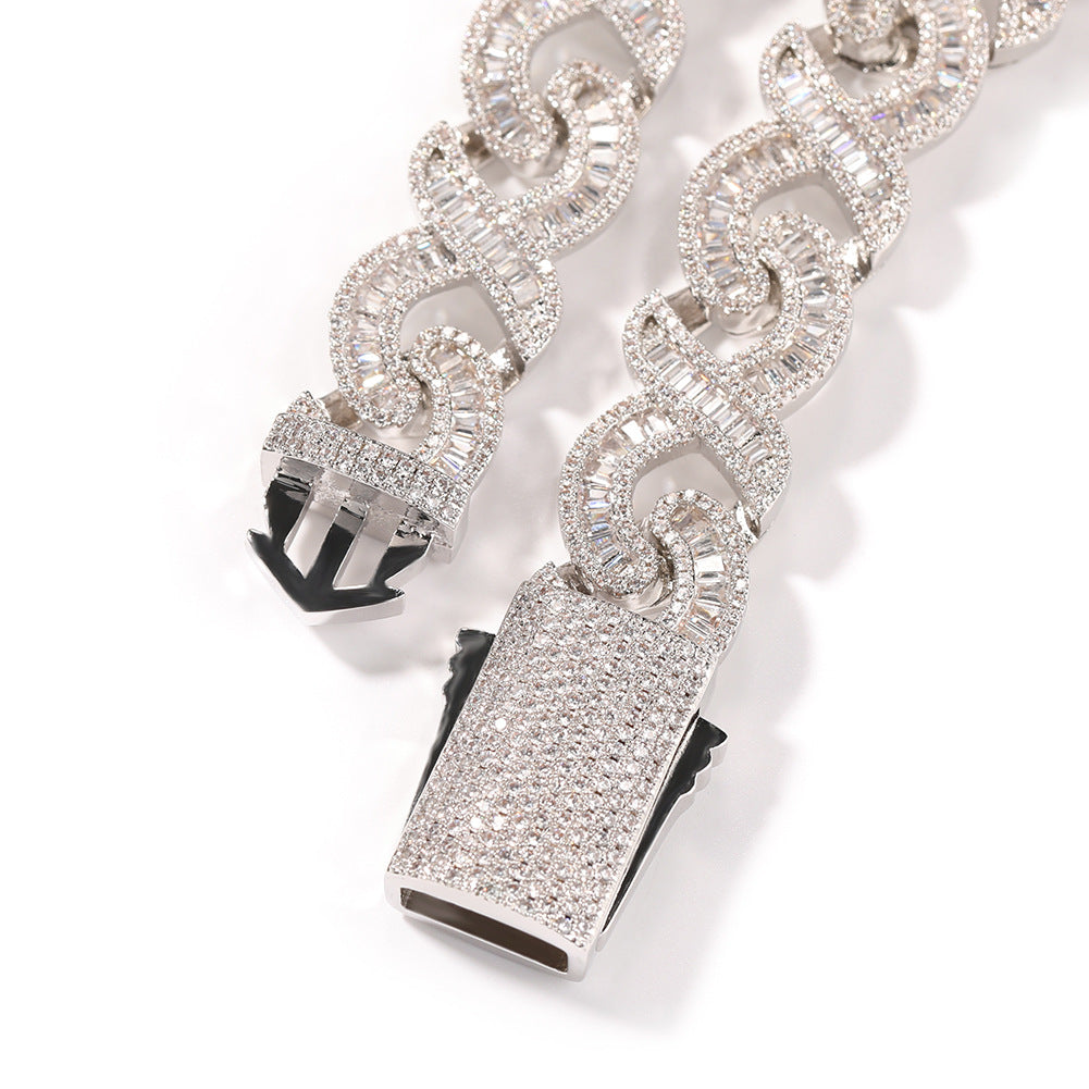 15mm diamond-cut geometric infinity Cuban chain from nowadaysfashion, showcasing a shiny, intricate gold jewelry design.