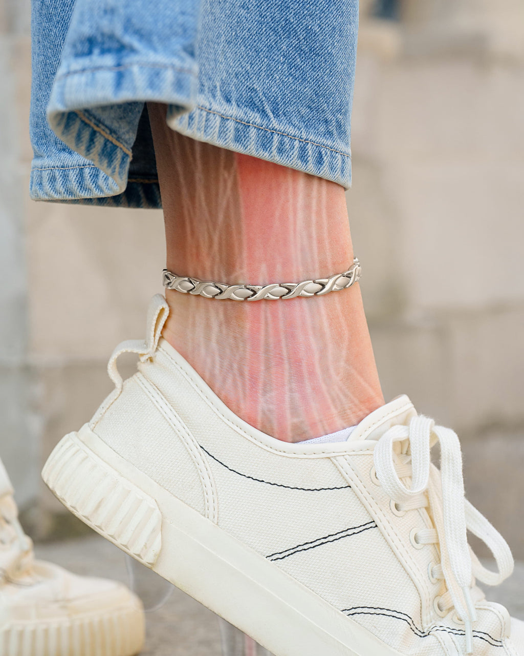 Silver titanium magnetic therapy anklet for women, featuring ultra-strength magnets and a sleek design by MagnetRX.