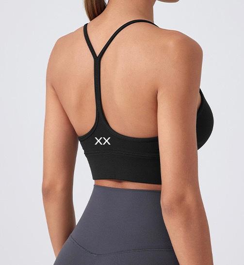 Blackout Barbell Milli Bra showing a sleek, stylish black bra with delicate straps and seamless design on a neutral background.